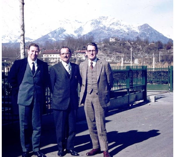 Robert Scott (right) with Bruno Getto (center). Ivrea, 1965 with the Alps in background.